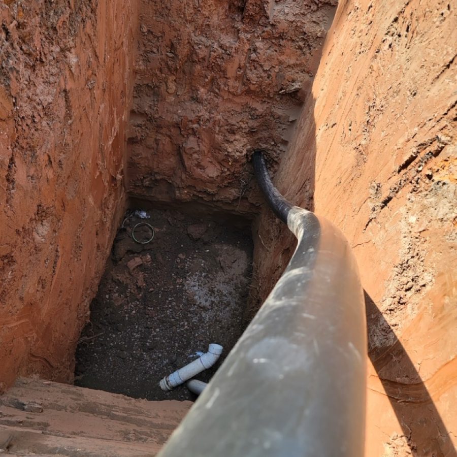 Trenchless sewer line work in progress on a residential property