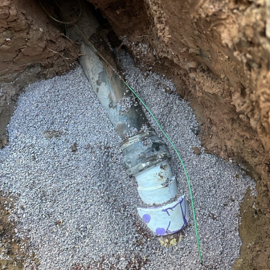 Pipe bursting equipment pulling a new HDPE sewer line in Duluth MN