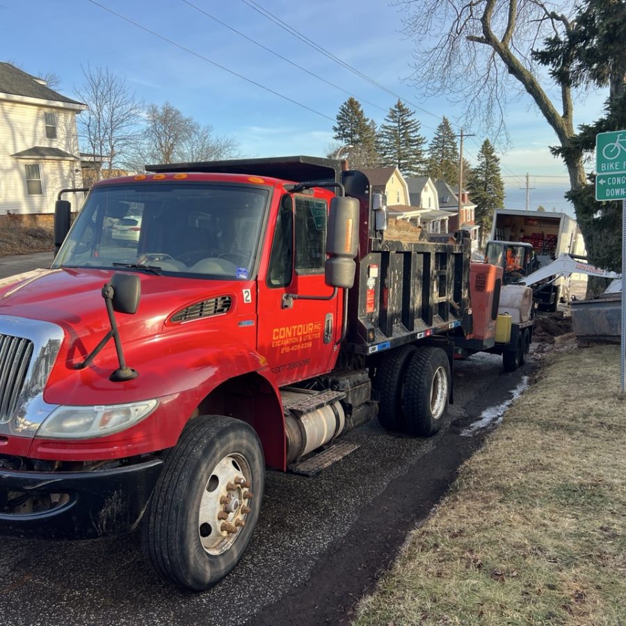 Contour Inc. commercial excavation vehicles on a Duluth job site
